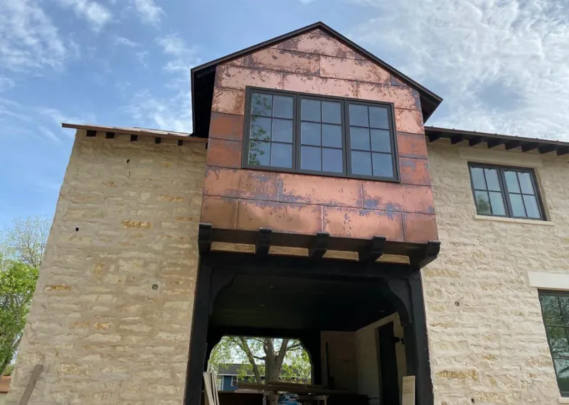 Copper metal panel facade on a stone building for Skylight Installation in Westlake Village